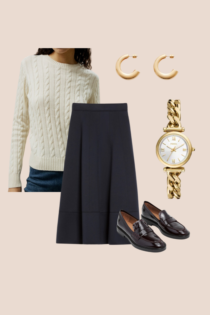 Thanksgiving outfit inspiration with a classic prepster look featuring a cream cable-knit sweater, navy pleated skirt, gold hoop earrings, gold chain-link watch, and dark leather loafers. Effortless, timeless style ideal for a polished Thanksgiving gathering.