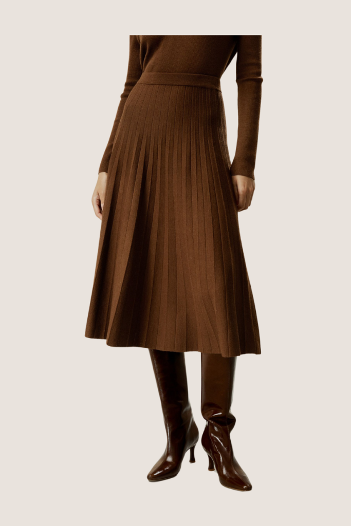 Elegant brown pleated midi skirt, adding a refined, flowing silhouette for a graceful and polished appearance.