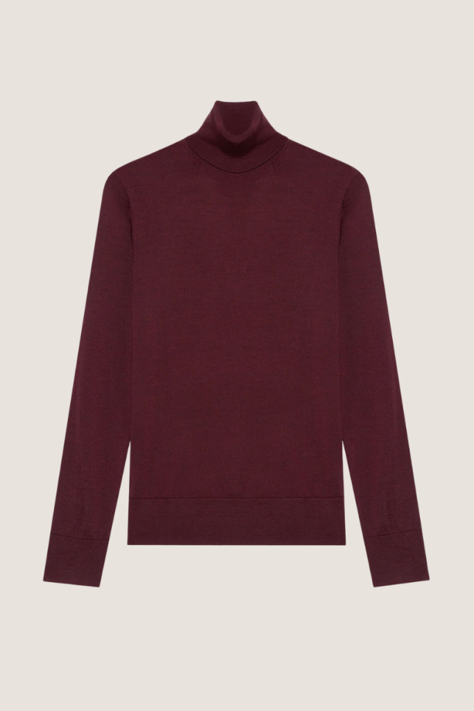 A sophisticated, long-sleeved burgundy turtleneck sweater, perfect for layering and adding a touch of timeless elegance to any outfit.