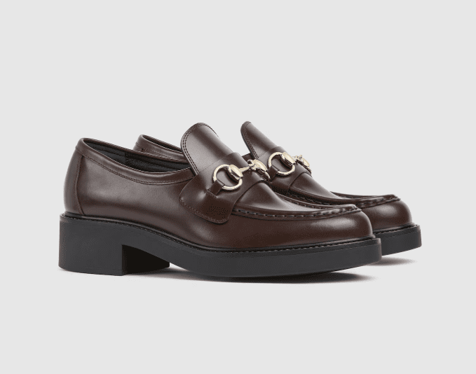 Polished brown leather loafers with low heel, structured and elegant example of old money shoe brands