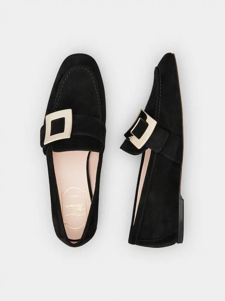 Black suede loafers with gold buckle detail, elegant flat style inspired by old money shoe brands
