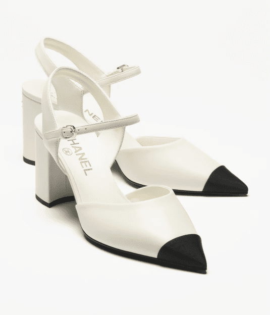 Ivory slingback heels with black cap toe, refined contrast design rooted in old money shoe brands