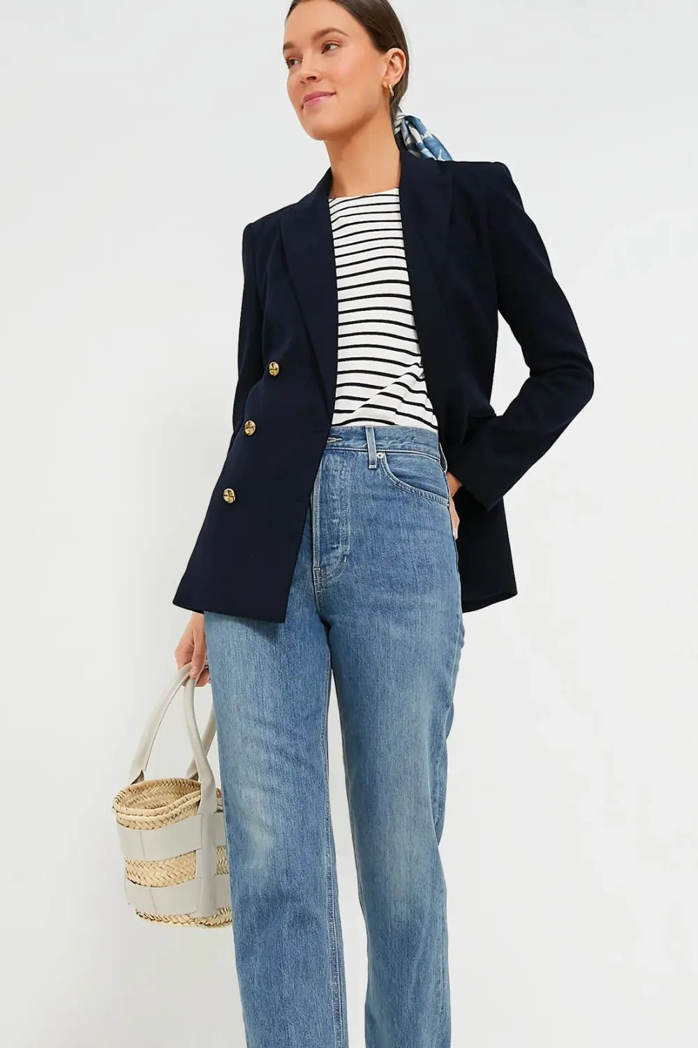 Navy tailored blazer styled with striped top and denim, a classic look from 7 Timeless Pieces to Start 2026 Right for everyday polish