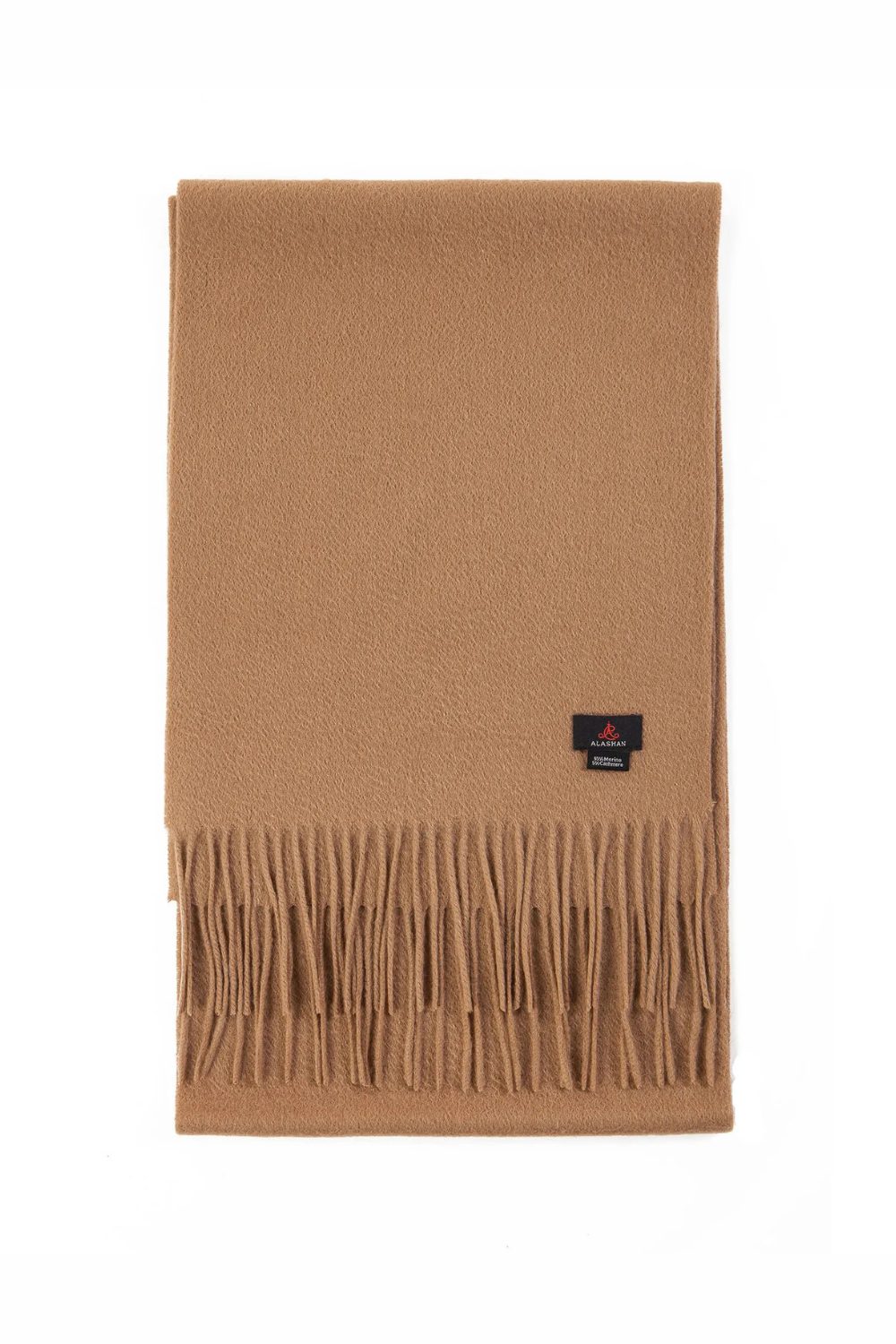 Soft camel cashmere scarf folded neatly, showing how 7 Pieces That Make Any Outfit Look More Expensive add warmth and polish