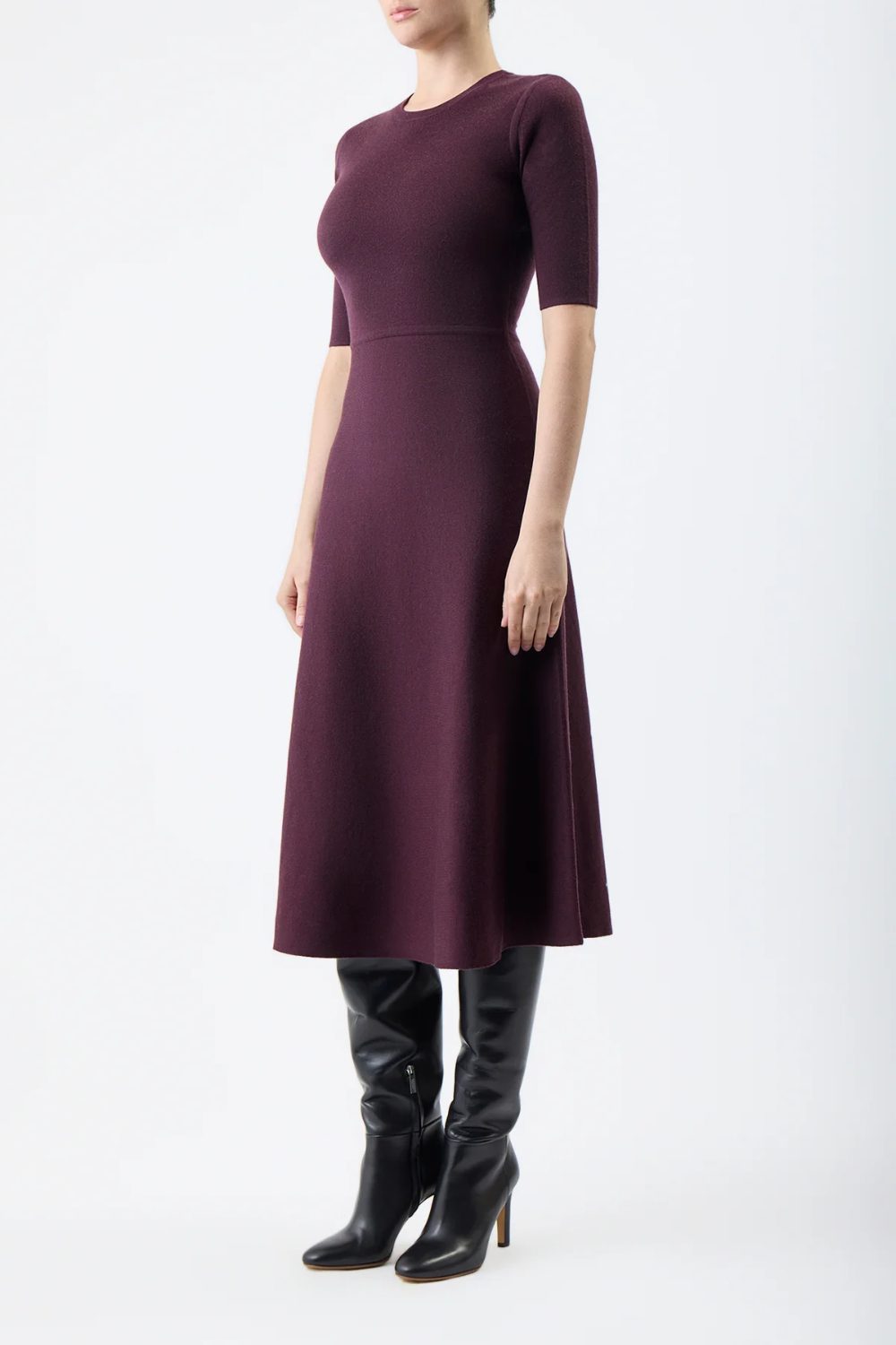 Elegant Date Night Outfits For 2026 with a burgundy short sleeve knit midi dress paired with tall black leather boots