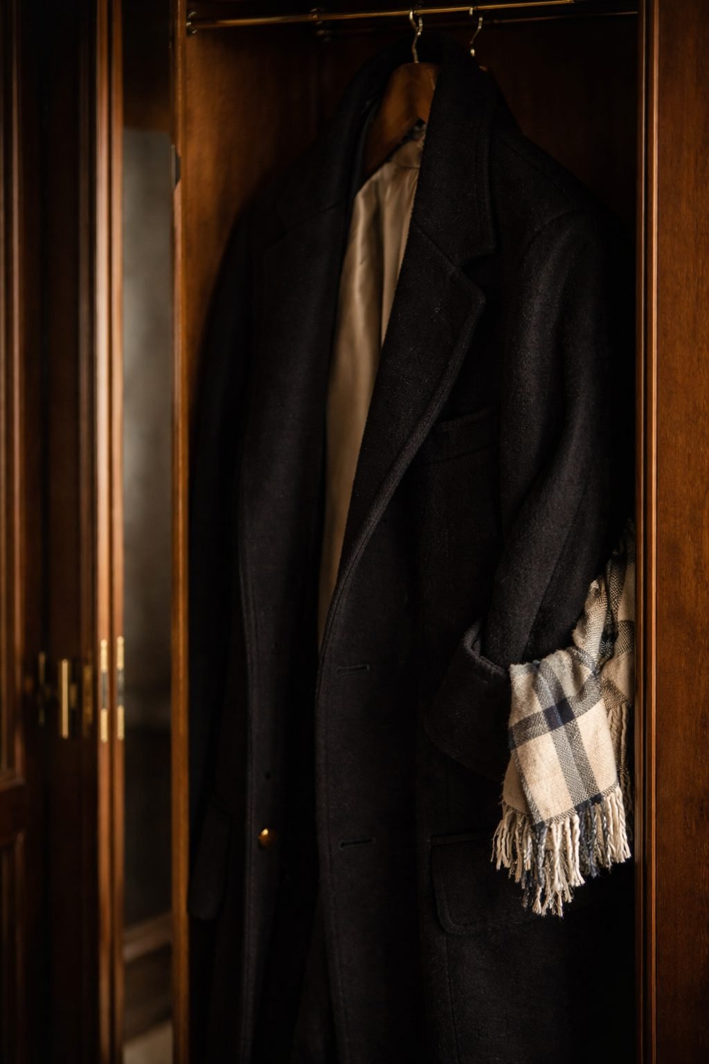 The Day I Realized I Didn’t Need New Clothes to Feel Elegant shown in a worn coat holding memories over time