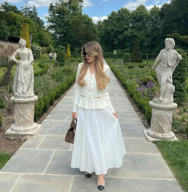 White Peplum Jacket With Flowing White Midi Skirt