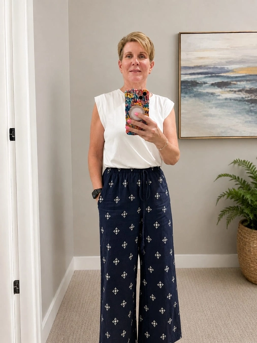White Sleeveless Top With Printed Wide Leg Pants