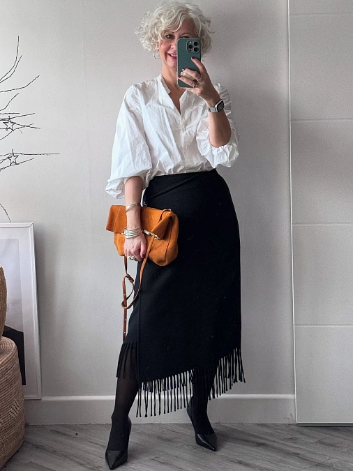 White Blouse and Fringed Black Skirt