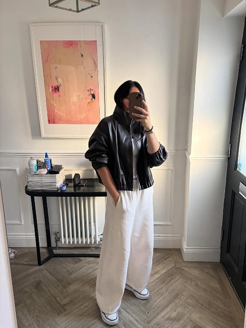 Black Leather Jacket and Cream Trousers