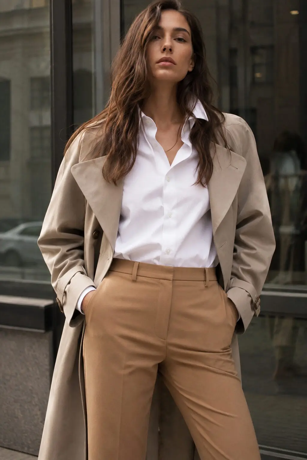 camel cigarette pants outfit with white button-down shirt and stone trench for office style