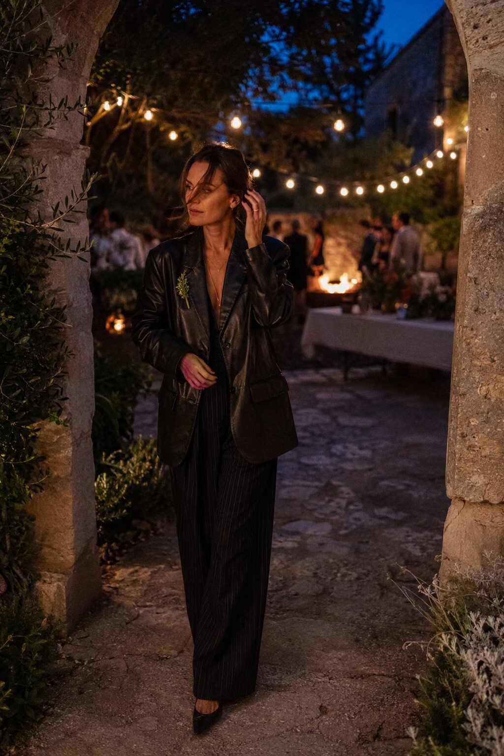 elevated witchy fall outfit: black leather blazer over pinstripe wide-leg trousers