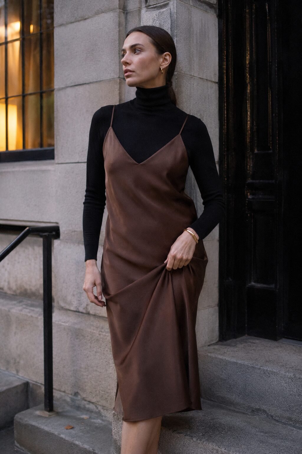 chocolate brown slip dress layered over a black fitted turtleneck, a 90s minimalist fall evening outfit
