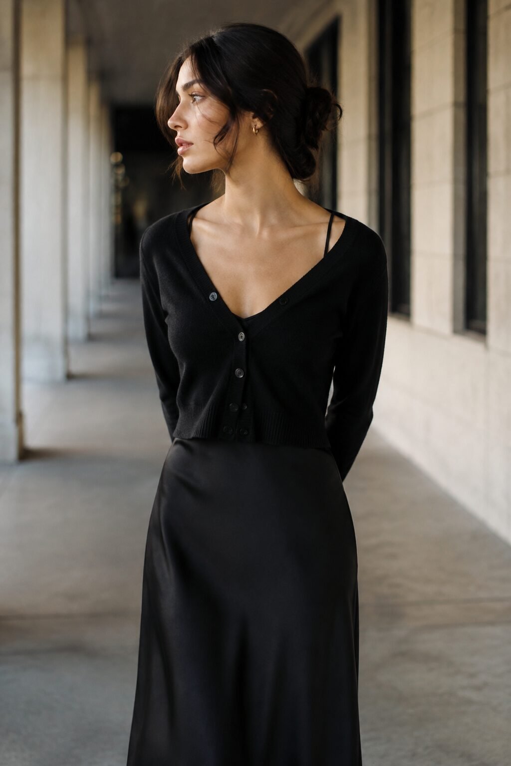 slip dress outfit idea: black spaghetti-strap slip dress under a cropped black cardigan