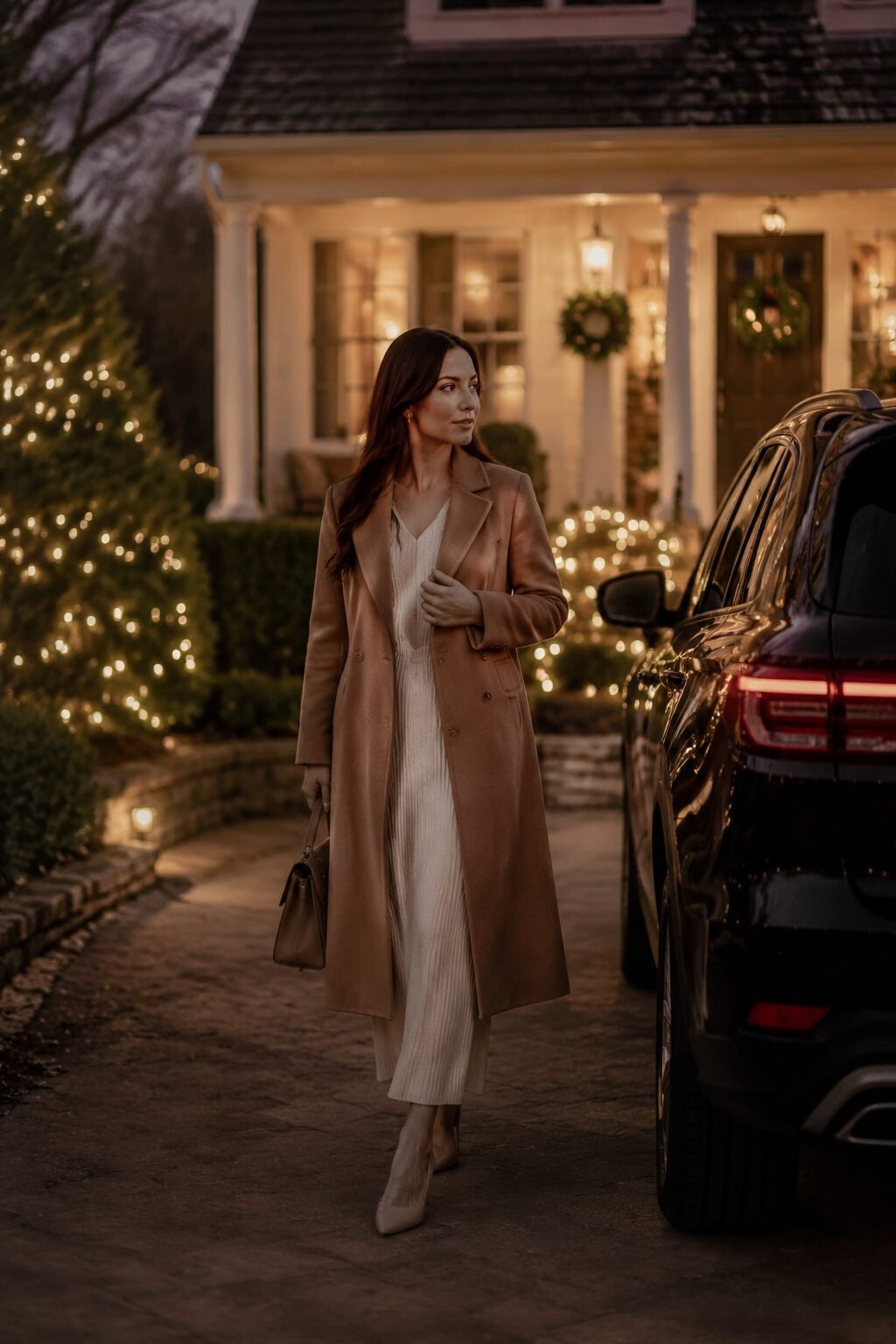 family christmas outfit idea for a drive to see lights: mother in a camel wool coat over a free-form outfit