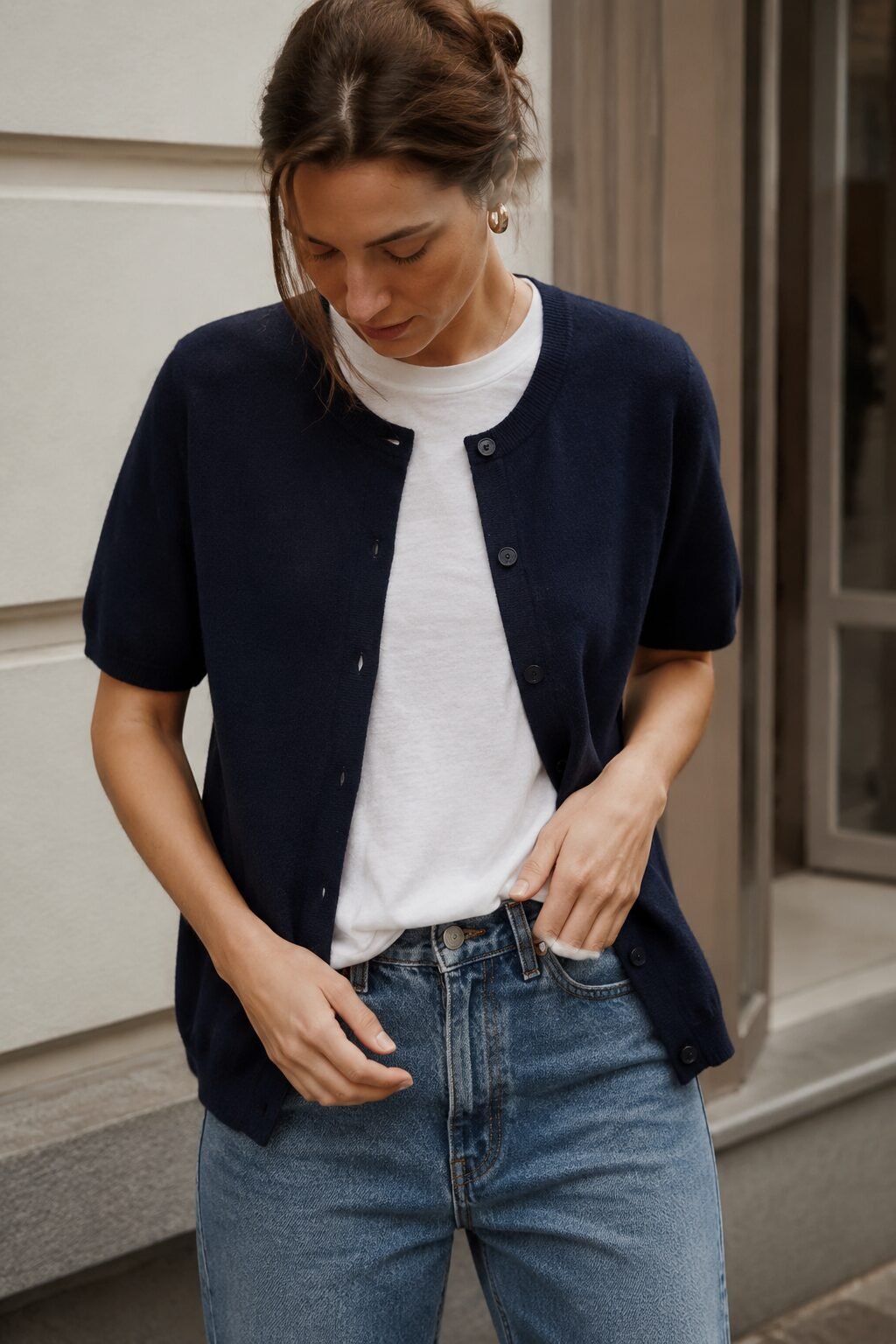 how to style a cardigan with a graphic tee: navy short-sleeve cardigan over a midnight navy t-shirt and straight-leg jeans, casual outfit