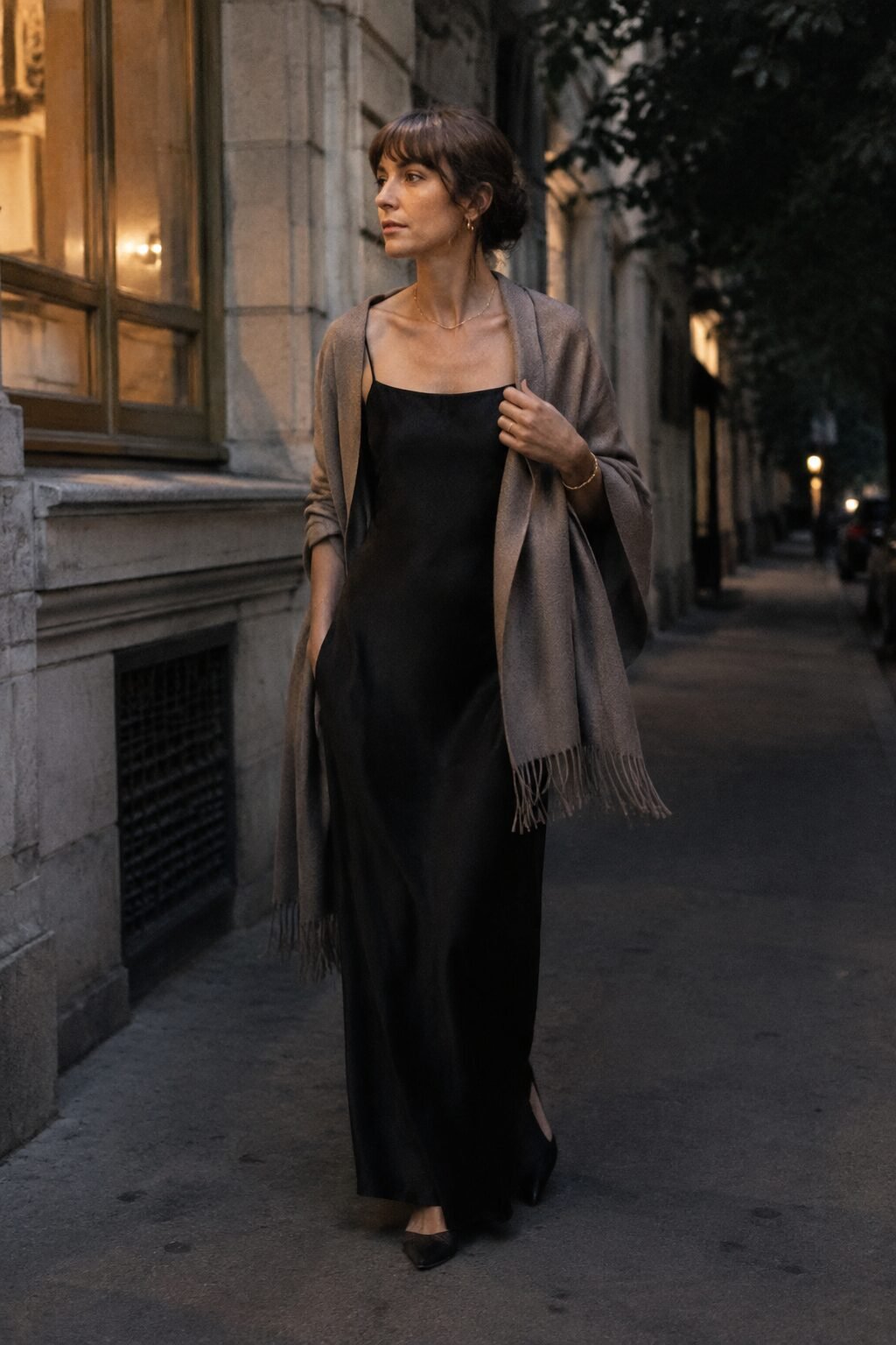 carolyn bessette slip dress outfit: black square-neck slip dress with a taupe cashmere wrap