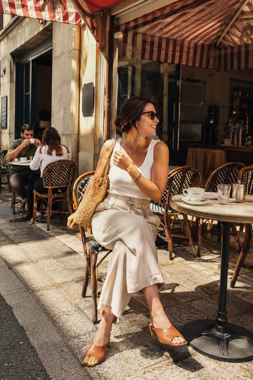 linen pants outfit in monochrome ivory: wide-leg Flax linen trousers, ribbed tank, and almond leather mules