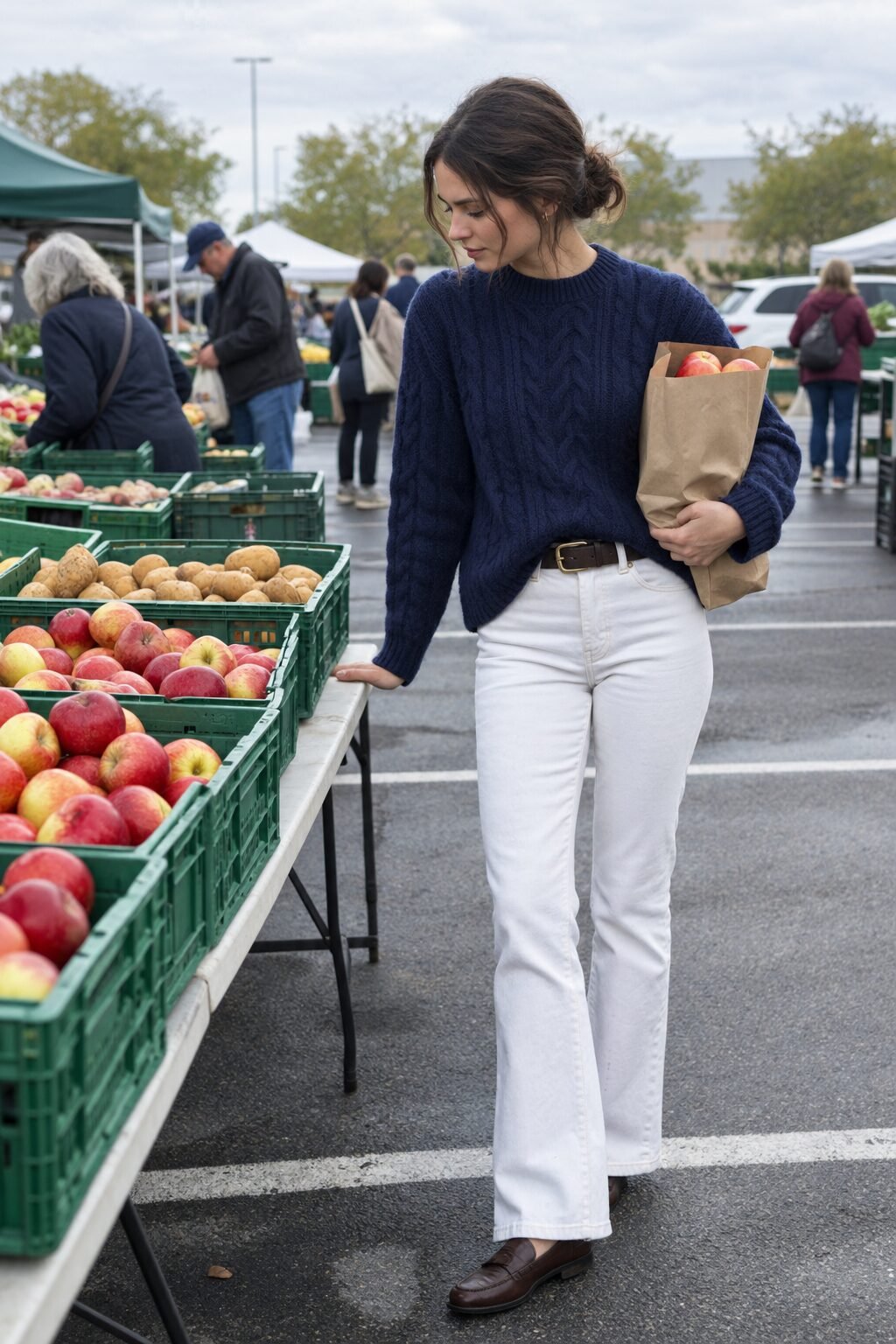 old money white outfit: white slim bootcut jeans with a navy cable crewneck sweater and brown penny loafers