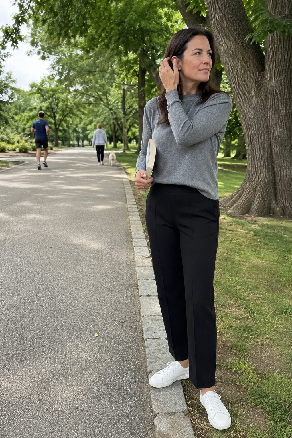 how to style elastic-waist trousers with a mole grey knit half-tucked and white leather sneakers