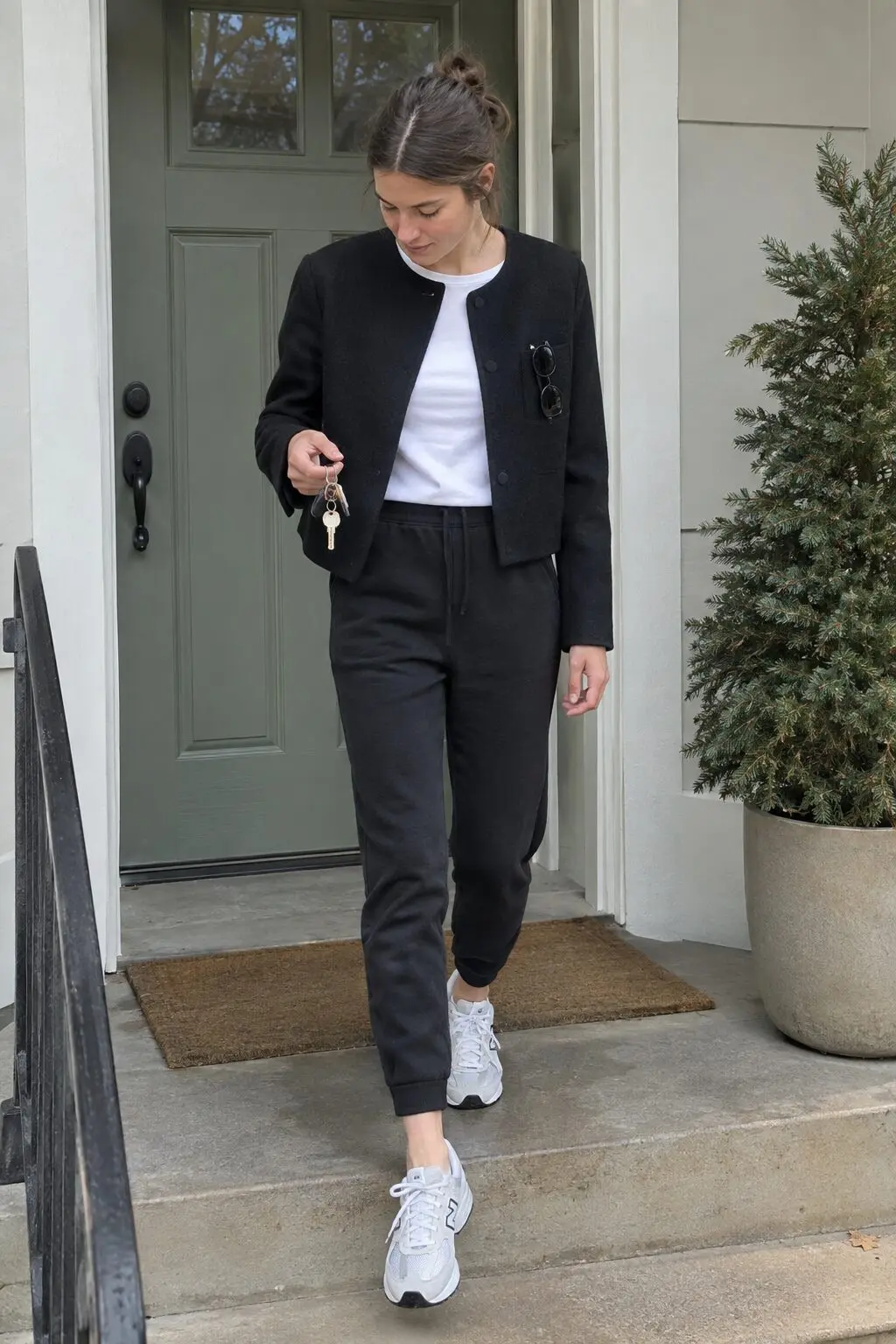 elegant loungewear outfit: black cropped merino wool blazer over a white tee with black fleece joggers