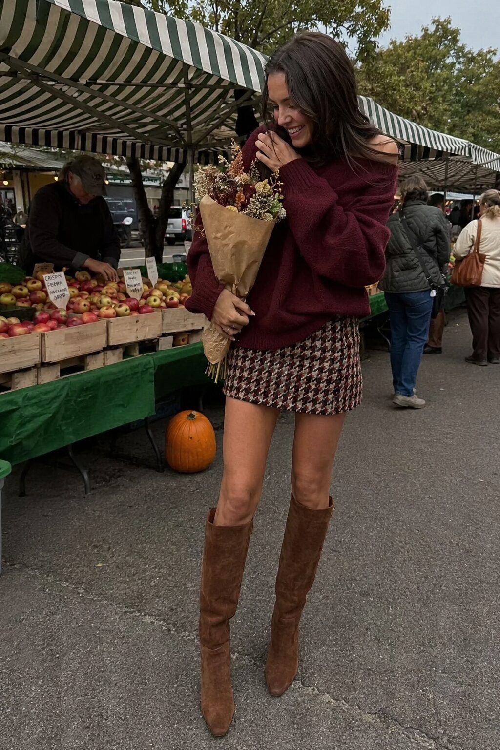 how to wear tweed this fall: charcoal and burgundy tweed mini skirt, oversized burgundy knit sweater, and tall brown boots