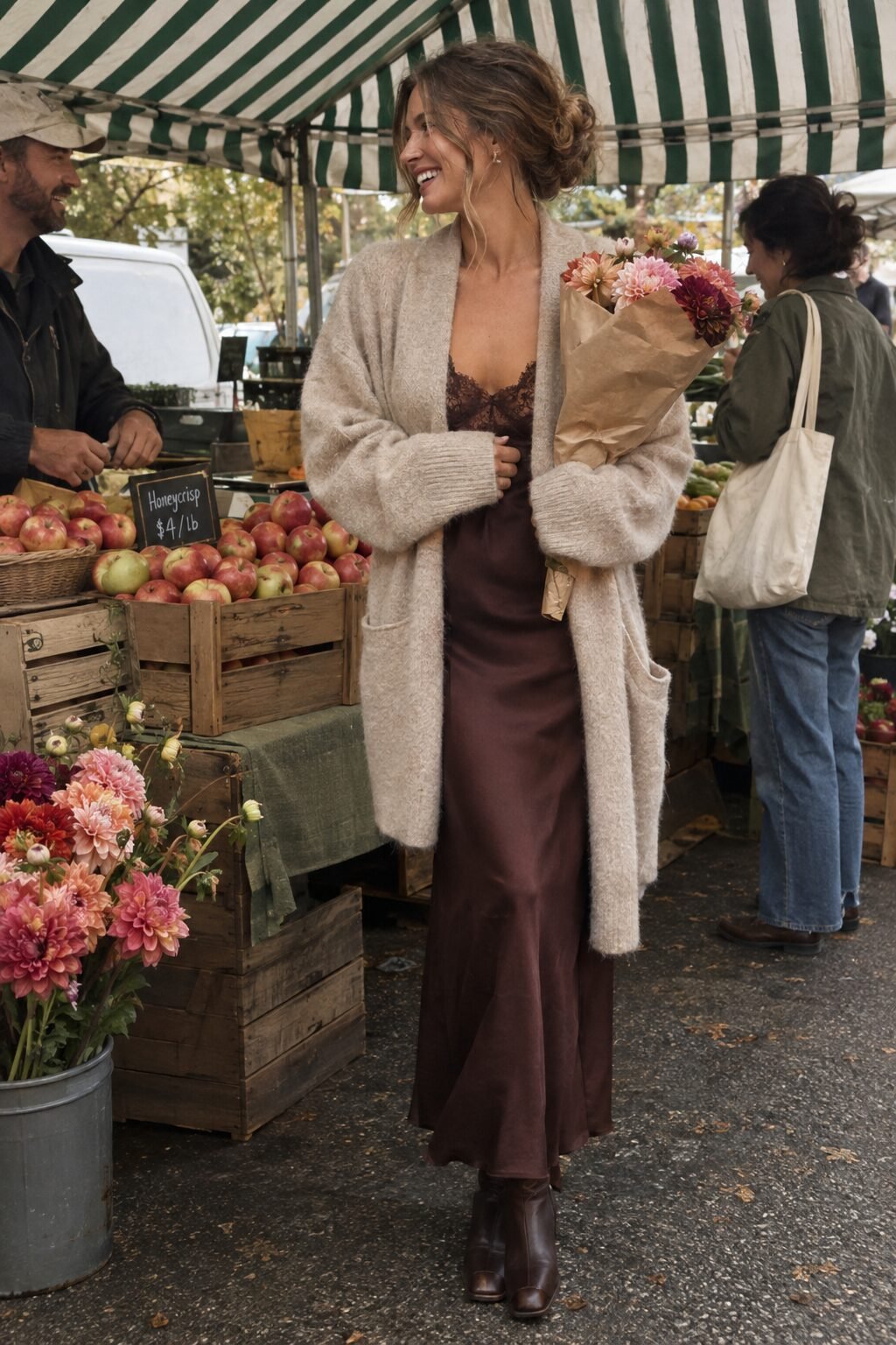 woman wearing an oversized oatmeal cashmere cardigan over a mahogany silk slip dress, fall layering for summer dresses
