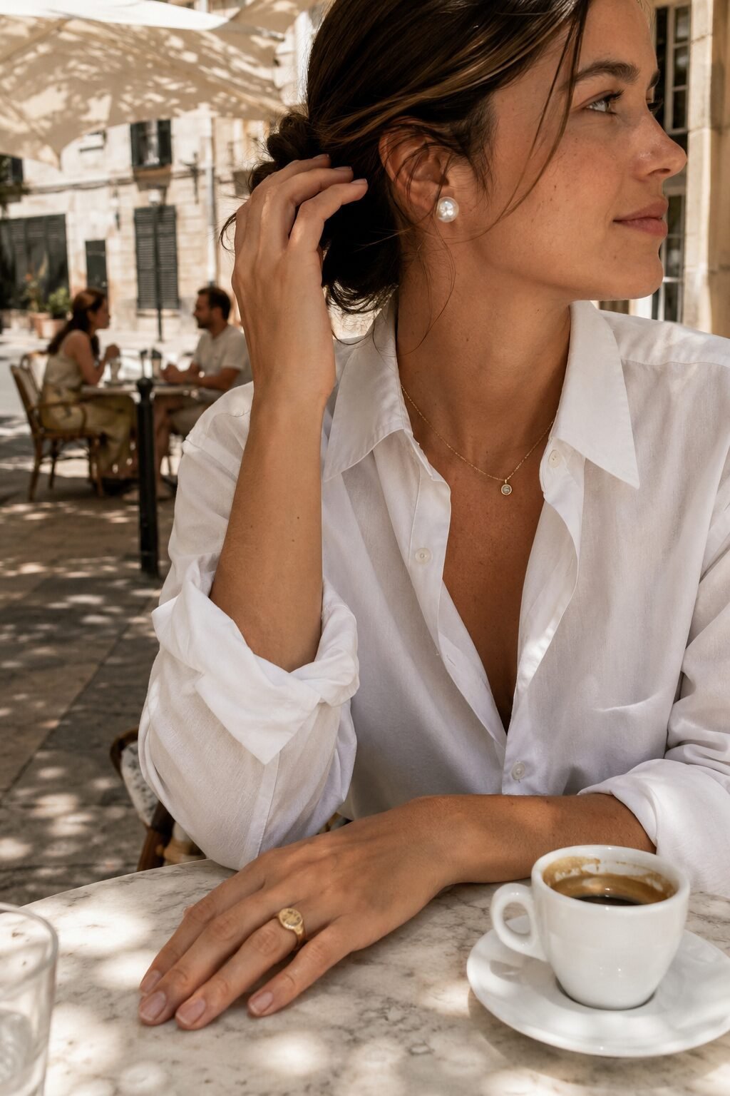 old money jewelry capsule: pearl stud earrings, diamond bezel necklace, and gold signet ring styled for a polished daytime look