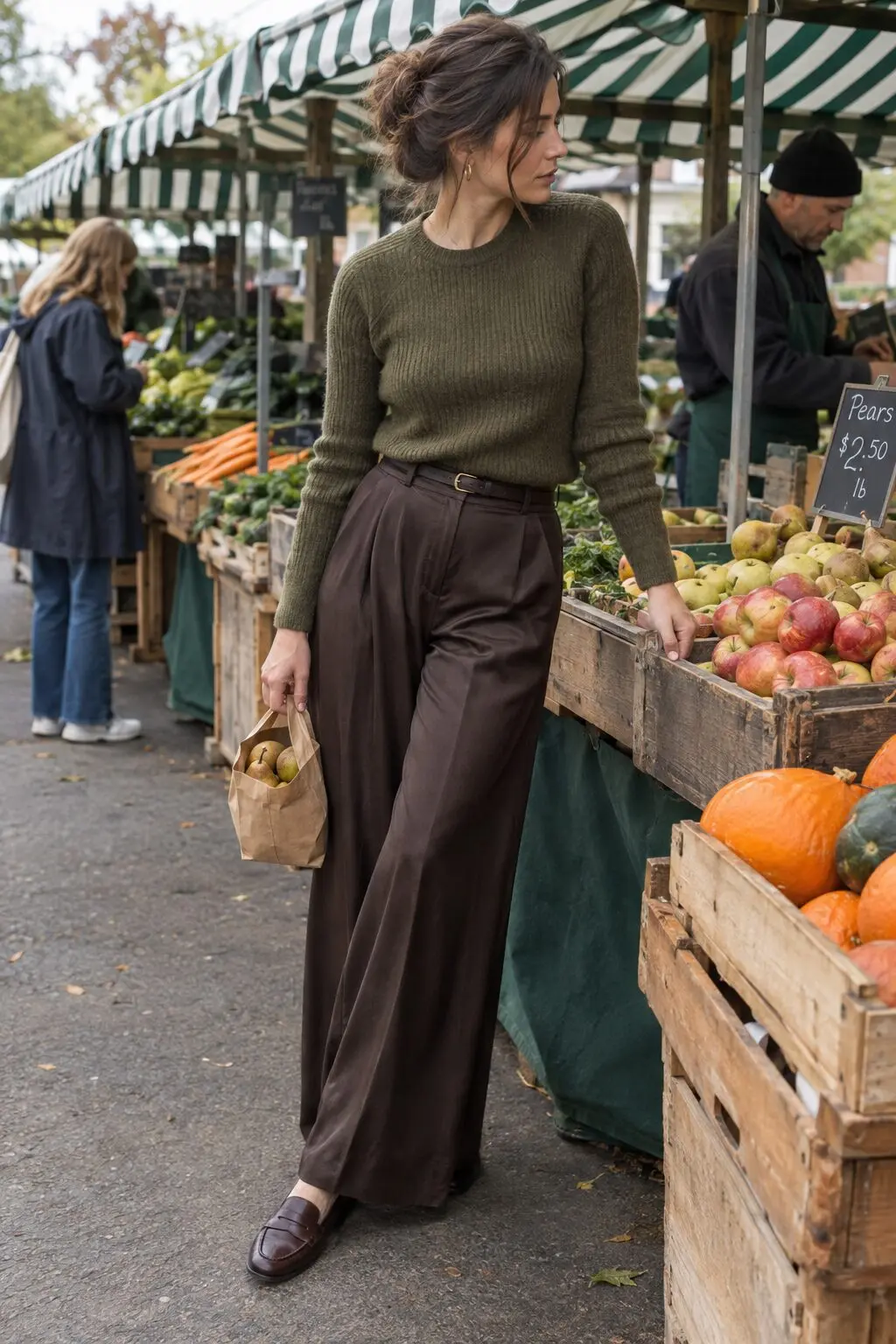 olive green fall outfit idea: ribbed olive sweater tucked into chocolate brown wide-leg trousers with cocoa loafers