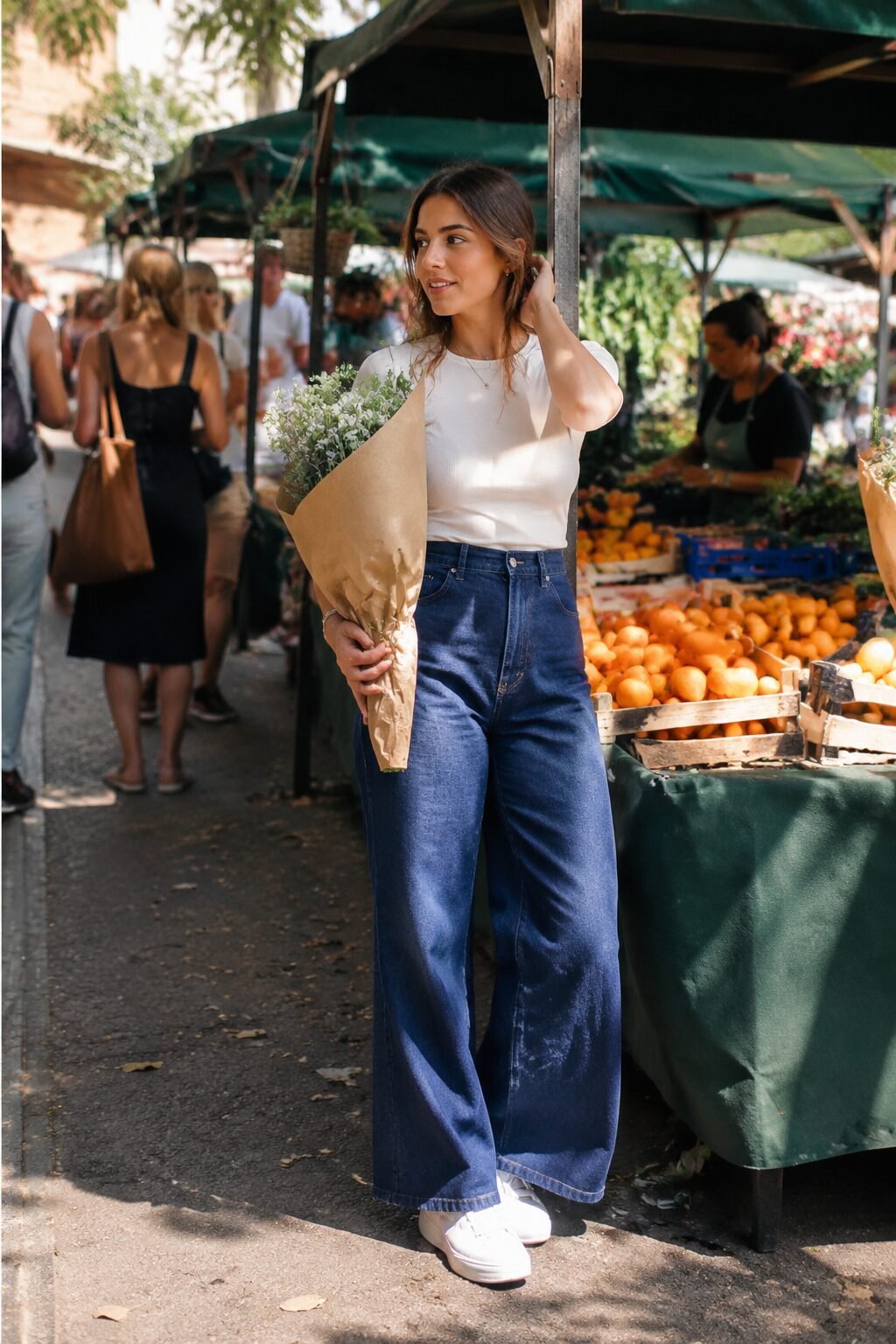 elegant white sneaker outfit with wide-leg denim and a fitted cropped jacket