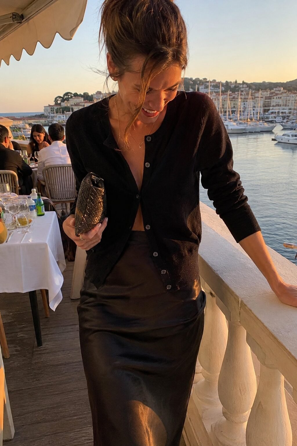 elegant all black halloween outfit idea: cashmere cardigan over satin bias skirt