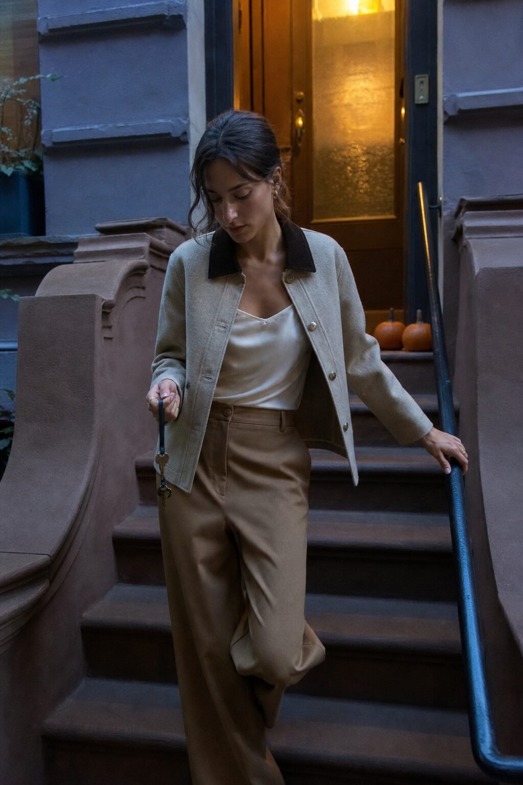 casual halloween party outfit: wide-leg trousers styled with a corduroy-collar jacket