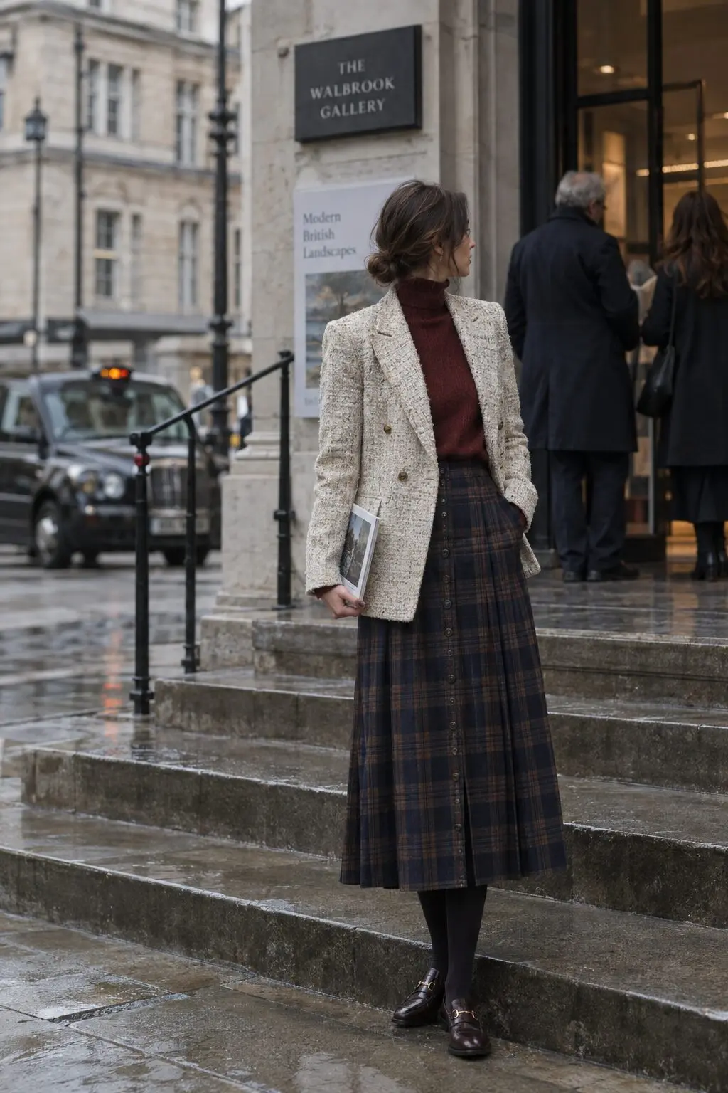 european street style fall outfit: ecru tweed blazer over a burgundy turtleneck and plaid midi skirt