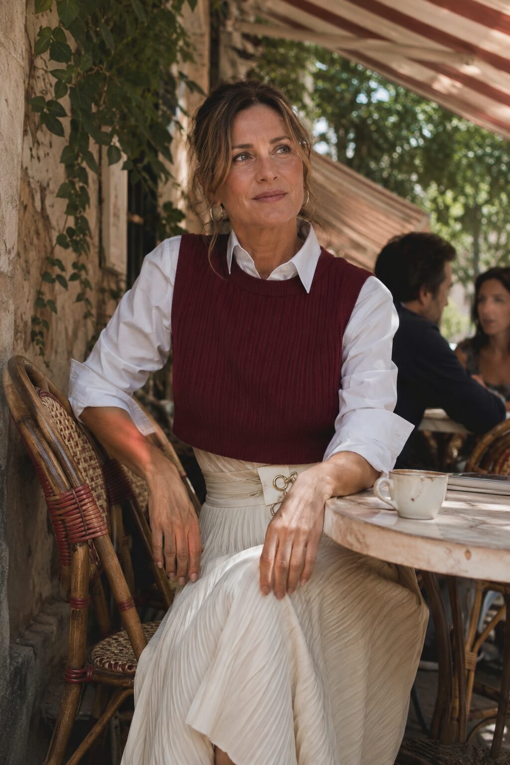 burgundy vest outfit for fall brunch, knit vest over white button-down and pleated midi skirt