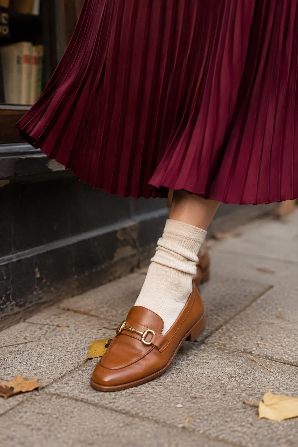 what to wear with brown loafers: burgundy pleated midi skirt and ivory sweater fall outfit