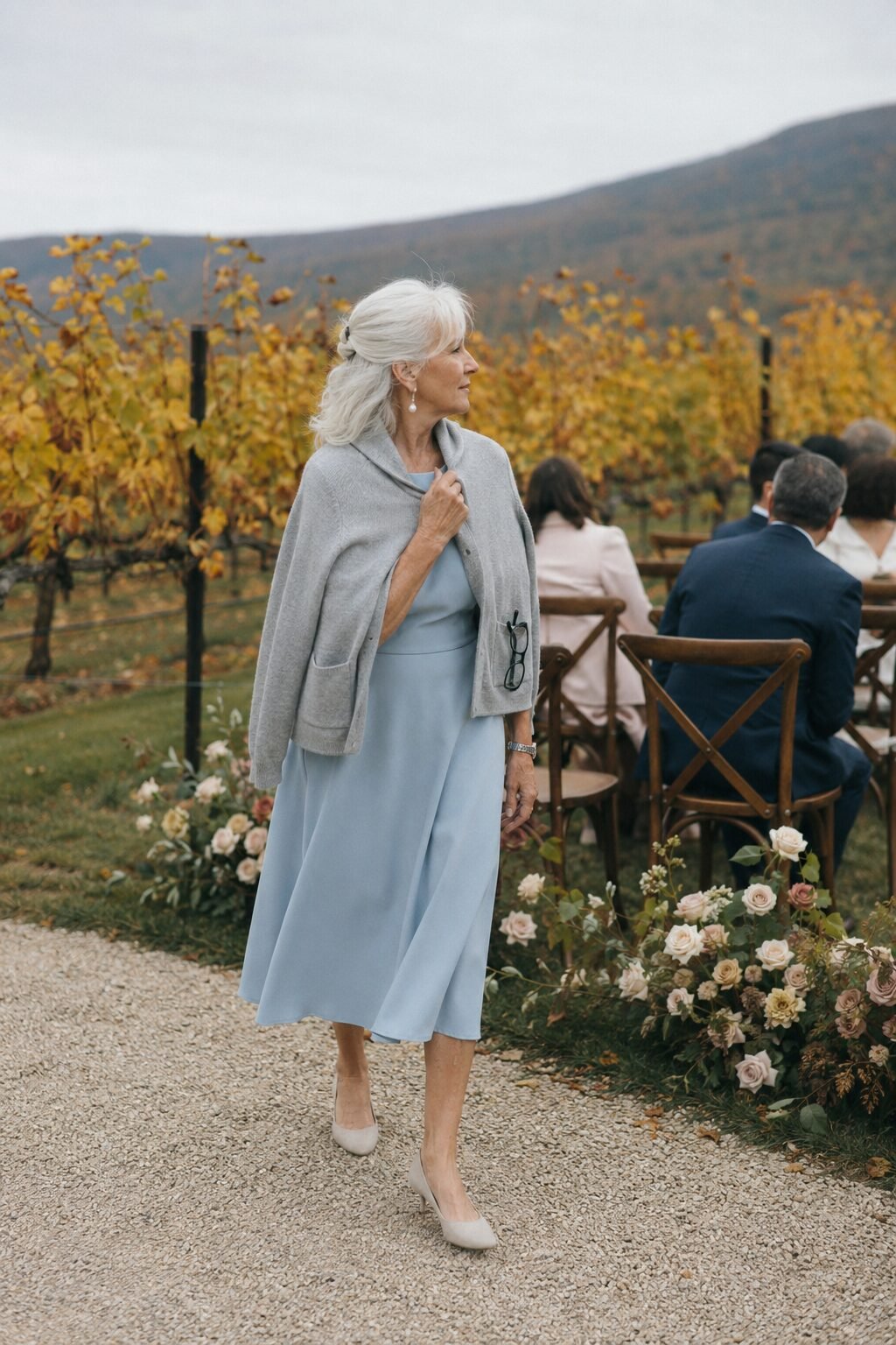 powder blue a-line midi dress with cropped dove grey cashmere cardigan, elegant grandmother of the bride outfit for an outdoor fall ceremony