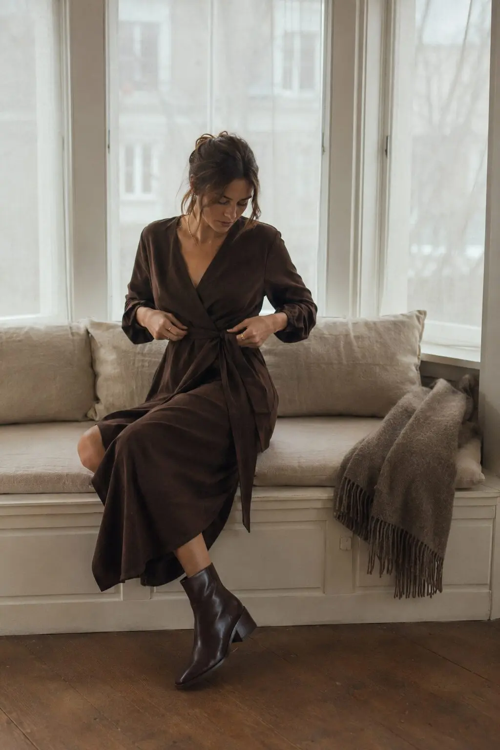 rich chocolate brown work from home outfit: wrap cardigan dress with ankle boots