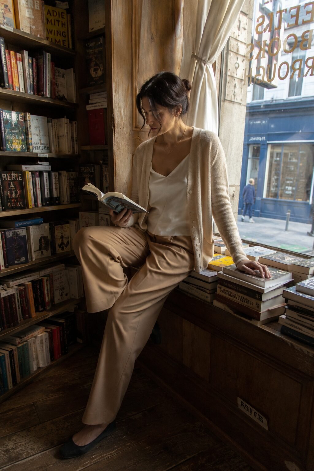 silk camisole layered under an open lightweight cardigan and trousers