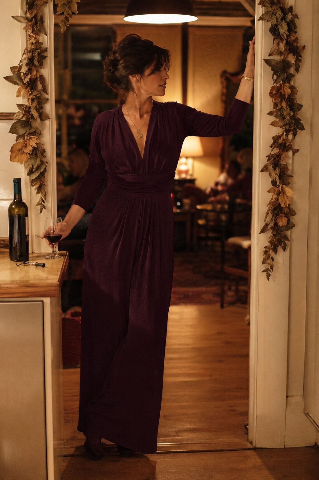 classy Halloween outfit for women over 40: deep plum draped wide-leg jumpsuit for hosting