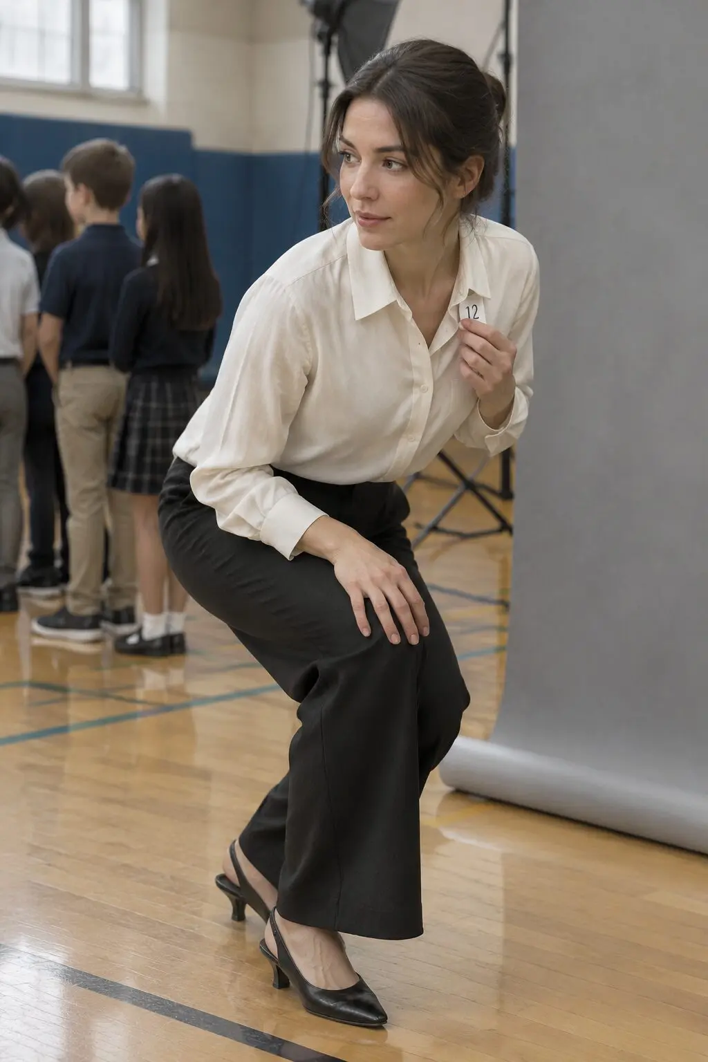 picture day teacher outfit: off-white silk blouse, black wide-leg trousers, and black slingback heels