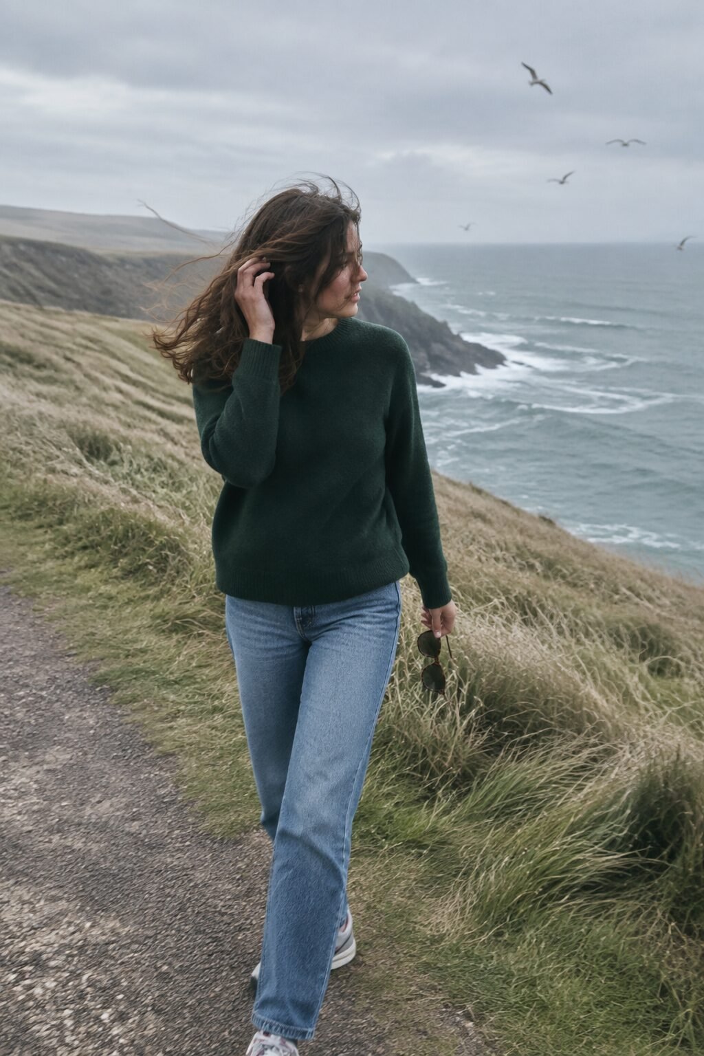 forest green cashmere sweater with straight mid-blue jeans, a casual weekend outfit that looks expensive