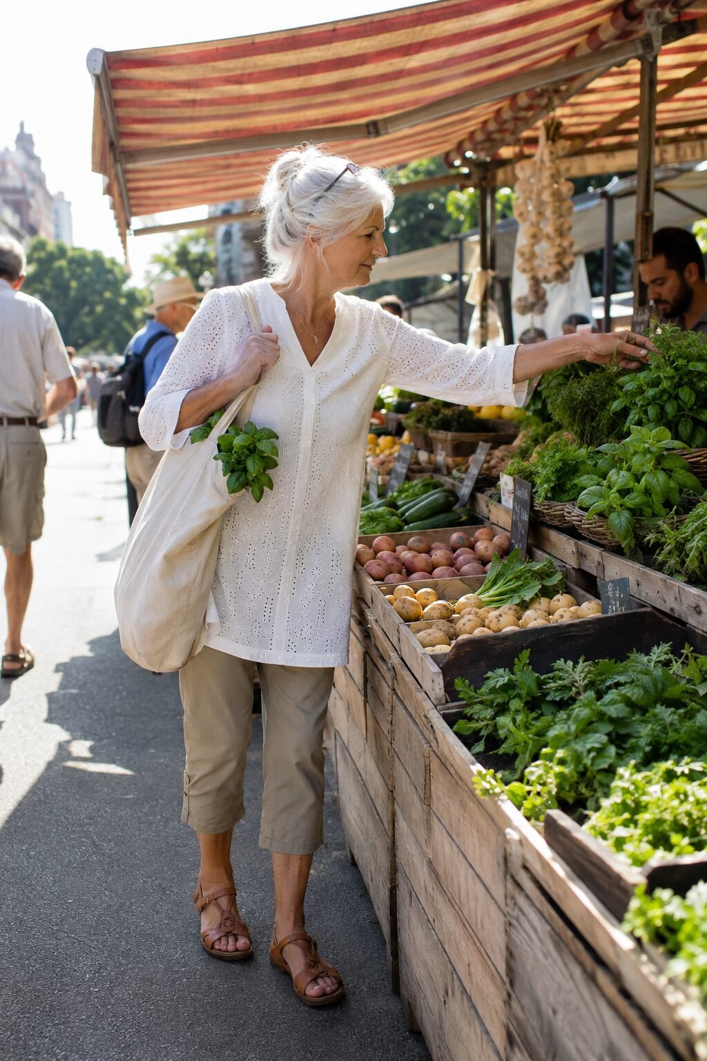 white cotton eyelet tunic with khaki cropped capri pants, breathable summer farmers market outfit for women over 70