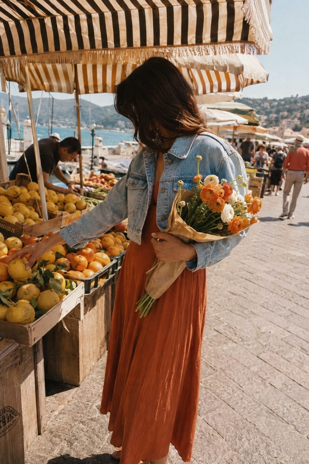 elegant errand day outfit: cropped light-wash denim jacket with a terracotta flowing midi skirt