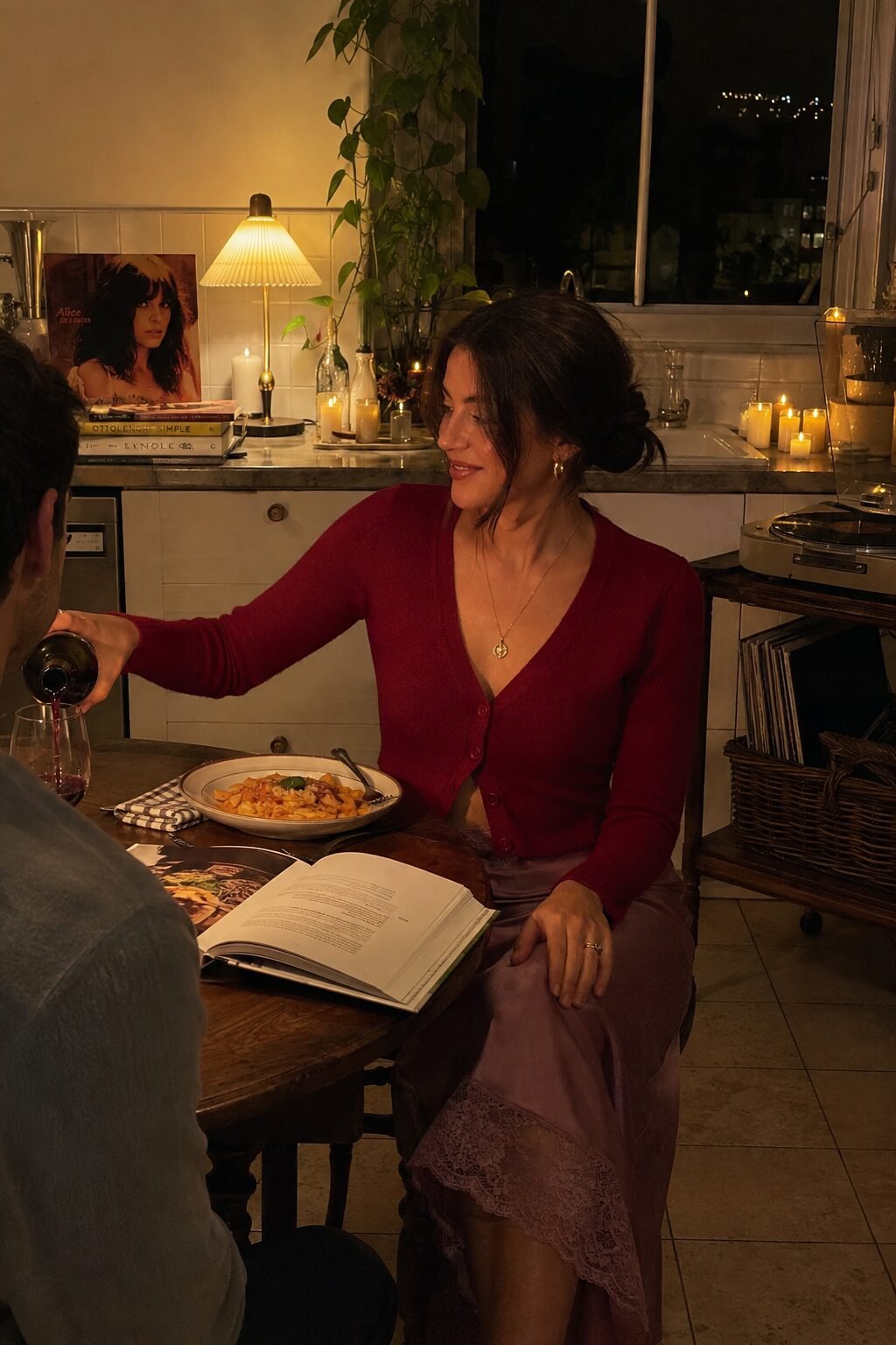 low-key halloween date night outfit at home: carmine red cropped cardigan over a dusty mauve satin slip skirt