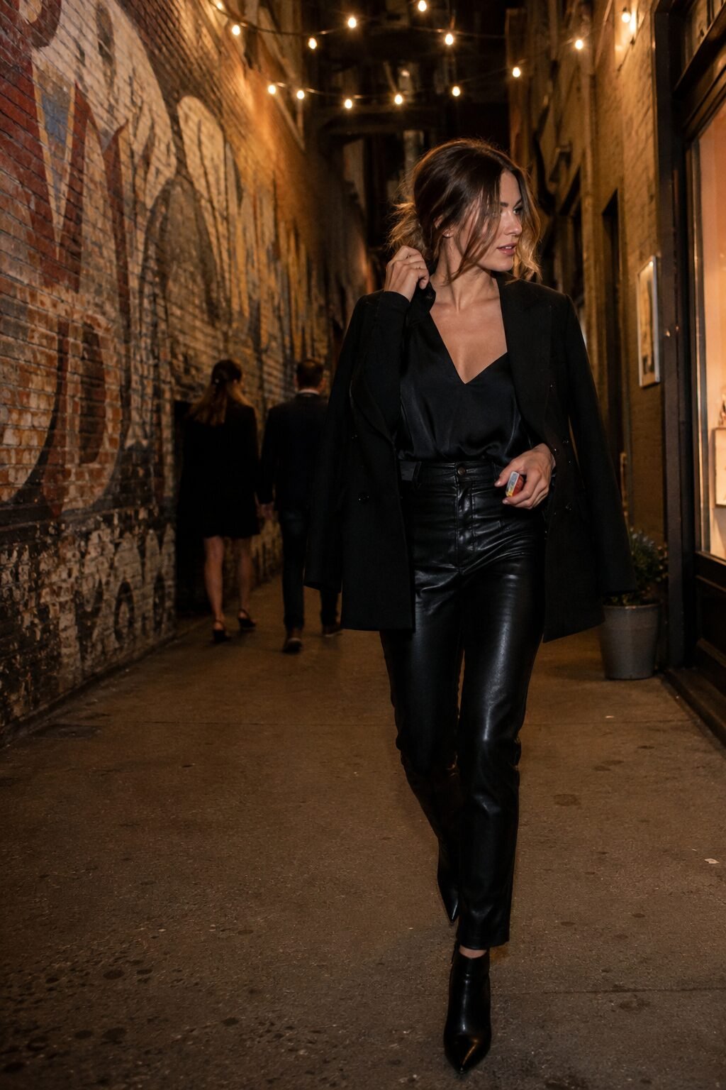 how to style a black blazer with leather pants for an edgy Halloween party outfit