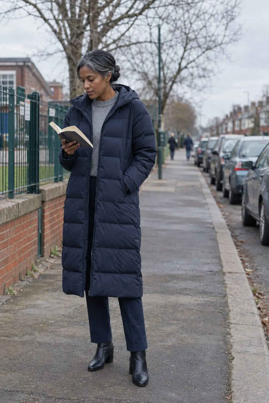 wrinkle free outfit for a cold school pickup: grey rib sweater, navy stretch pants and long navy puffer