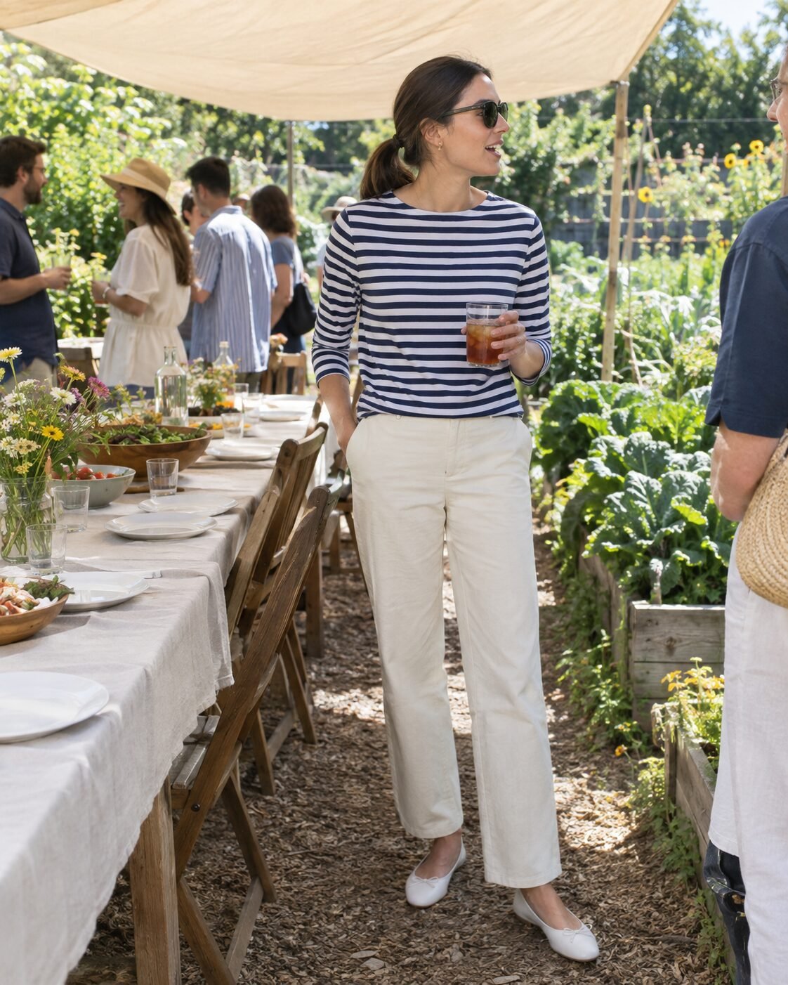woman in a navy striped top and plain trousers, one quiet print for a classy casual event outfit
