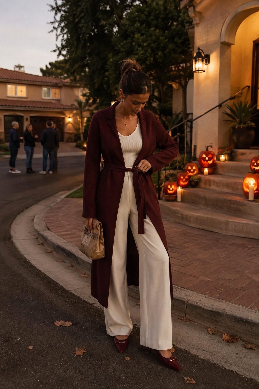 burgundy long open cardigan-coat over an ivory ribbed tank and wide-leg trouser, elegant halloween outfit for moms trick-or-treating
