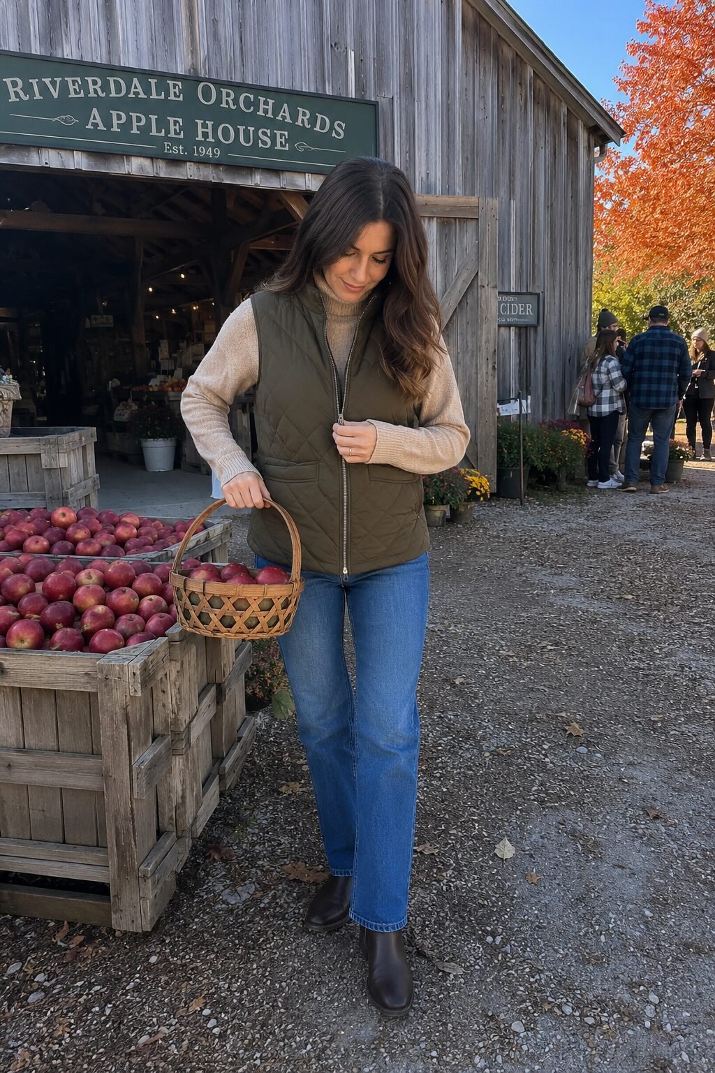 classy fall outfit: quilted vest over chunky turtleneck with straight-leg jeans