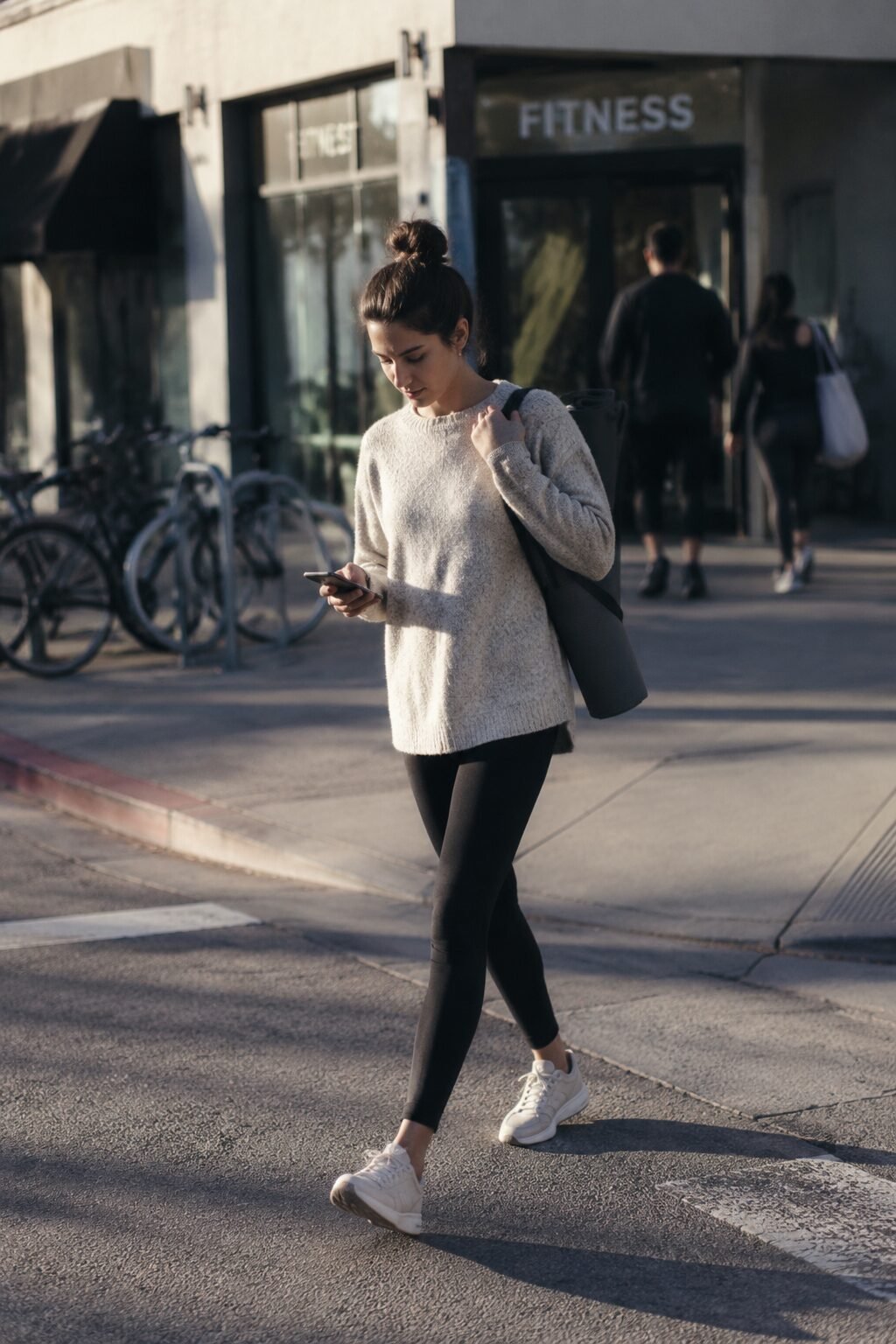 elegant outfits for running late: black ponte legging with long oatmeal tunic sweater for errand day